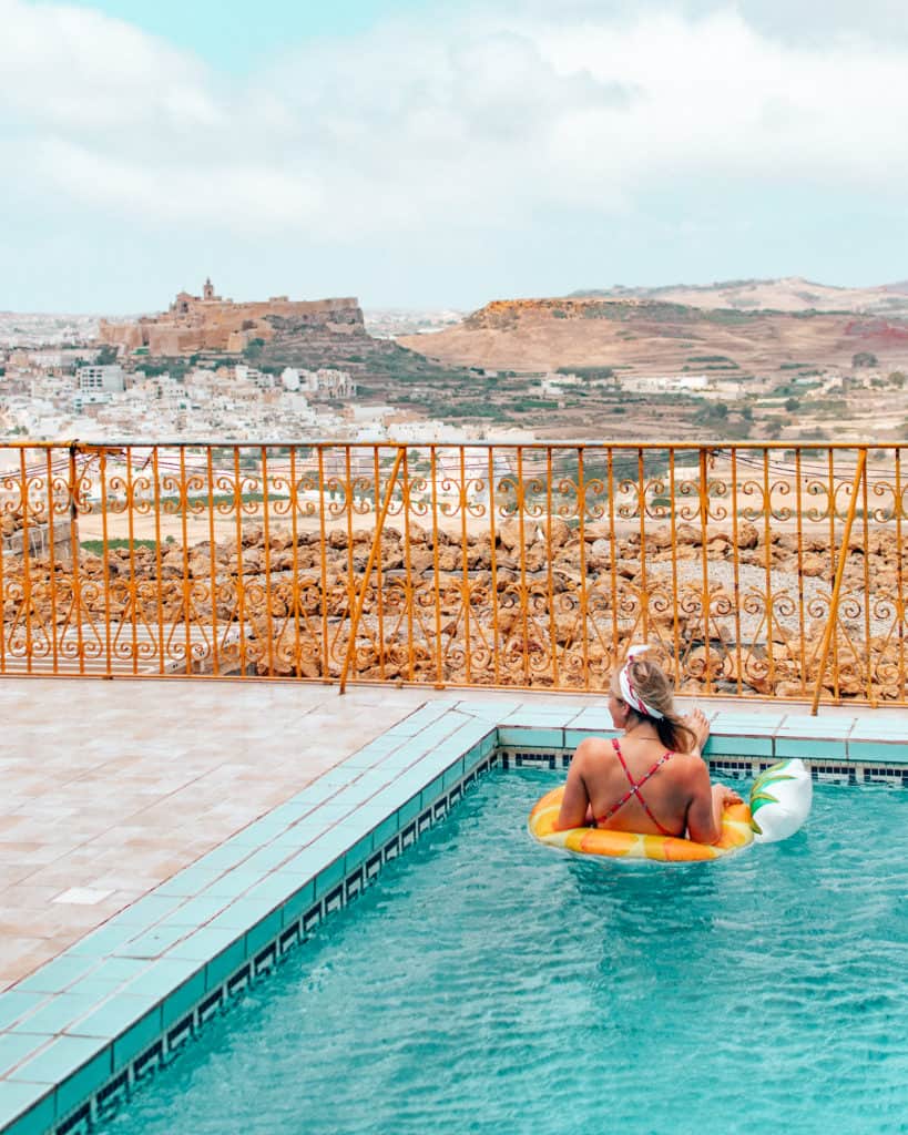 girl in pool with view