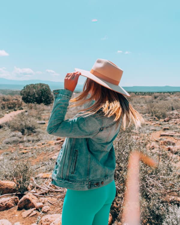 girl wearing cowboy hat at Bandelier