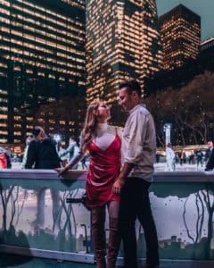 couple standing in front of ice skating rink