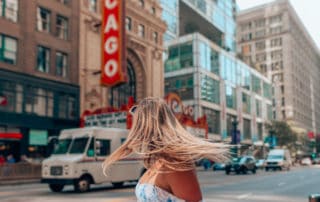 girl standing outside Chicago theatre