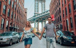 couple in front of Manhattan bridge