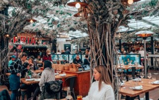 girl sitting at restaurant table with winter decor