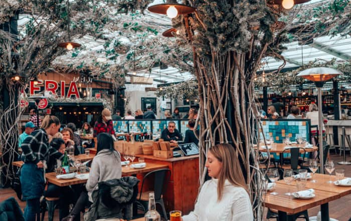 girl sitting at restaurant table with winter decor