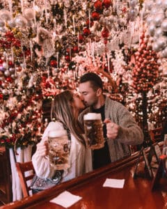 couple sitting at bar with 2 drinks