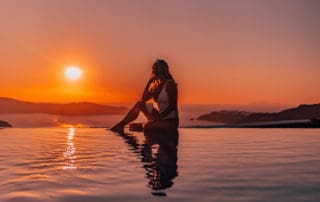 infinity pool orange sunset