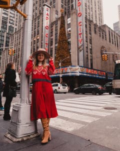 girl standing in front of music hall