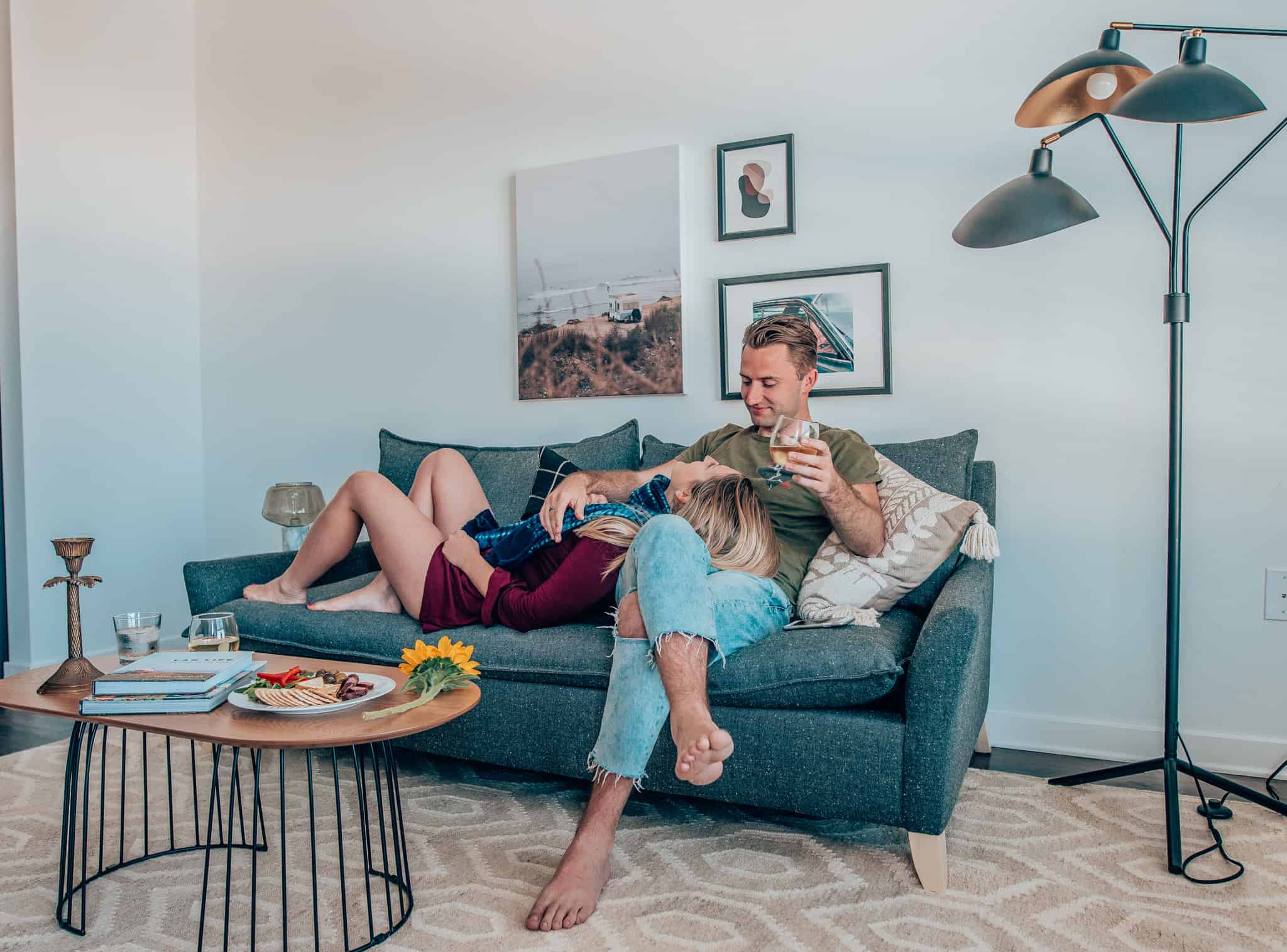 couple laying on couch at Sonder Apartment